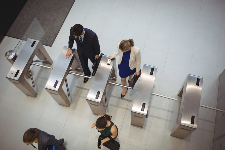 Turnstiles at Office 4 Steps to Maintain Your Boom Gates and Turnstiles 1 Overhead view of people using turnstiles. Maintain your boom gates and turnstiles for smooth operation.